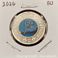 Reverse of coin showing coloured CN Tower 50 Years design