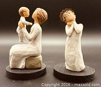 Front view of both Willow Tree figurines on display bases