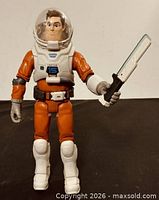 Front view of Buzz Lightyear figure holding accessory