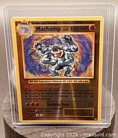 Front view of sleeved Machamp LV.67 160 HP holographic card