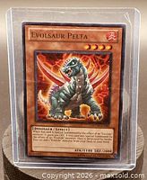 Front view of Evolsaur Pelta card in sleeve showing artwork, stats and set info