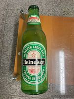 Front view of the Heineken plastic bottle wall sign