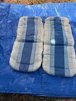 Two full-length cushions laid side by side showing overall pattern and condition
