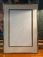 Full view of diploma frame showing double mat and gold-tone frame
