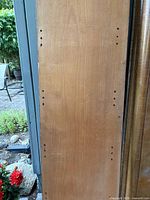 Full view of plain door panel with pre-drilled holes