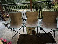 Triple folding camping chair set up on patio