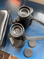 Top view of eyepieces, focus rings, caps and partial case