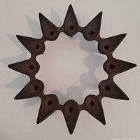 Top view showing full starburst form and twelve candle sockets