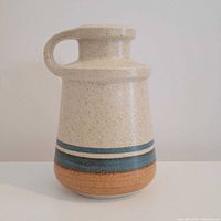 Front view of speckled Lapid handled vase showing glaze and color bands