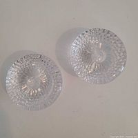 Top view of both textured glass holders showing pattern and shape