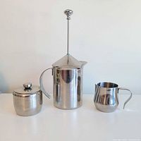French press, sugar bowl, and creamer pitcher together