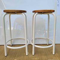 Two IKEA Teddy bar stools front view