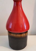 Full front view of red and brown West German pottery vase