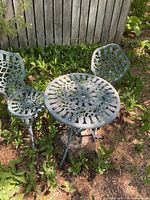 Bistro set outdoors showing table and two chairs