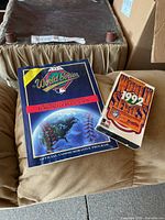 Front covers of program and VHS displaying titles and graphics