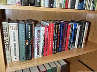 Left portion of shelf showing first eight hardcover titles