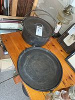 Pot with lid next to shallow pan