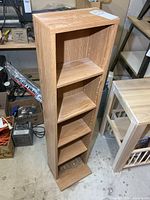 Full view of tall media stand front and side
