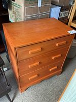 Front view of solid wood three-drawer dresser