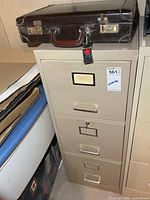 Cabinet front view with briefcase on top