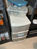 Organizer with totes stacked on top, jars visible
