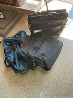 Group of four assorted bags on floor