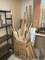 box and corner area filled with varied trim sticks and boards