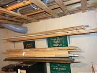 Wide view of both wall racks with stacked lumber boards and trim