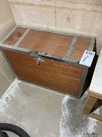 Front view of wooden machinist chest with key inserted