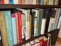 Shelf with multiple Old Testament theology volumes and additional commentaries
