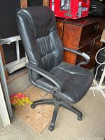 Full view of chair front showing upholstery, armrests, and backrest