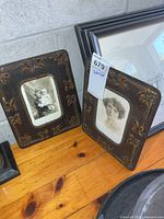 Both framed photos front view