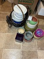 Group shot of all planters stacked with wicker basket