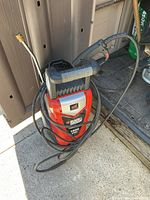 Full view of Black & Decker electric pressure washer with hose and wand attached