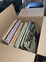 Box filled with upright LP records, Bob Dylan album at front