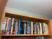 Full view of entire top shelf of books