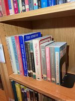 Full shelf view showing majority of religious books and bookend