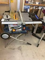Full view of Ryobi table saw on folding stand