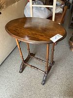 Full view of oval side table, top and legs visible
