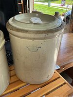 Crock with lid showing exterior stamp and overall appearance