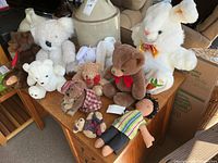 Group of assorted stuffed animals on dresser
