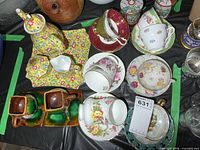Full lot showing teapot set, assorted teacups, Vallauris cups