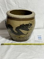 Whole dragon jar with scale reference and lot sticker