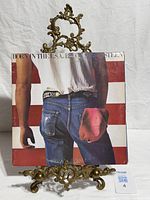 Front cover of Bruce Springsteen Born In The U.S.A. LP on stand