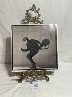 Front cover of Bryan Adams Cuts Like A Knife LP on stand
