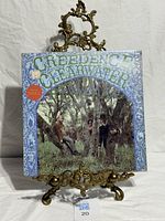 Front cover showing title, band photo and Susie Q sticker