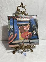 Front jacket of Cyndi Lauper LP on display stand