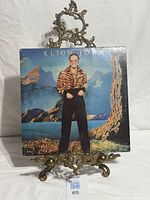 Front cover of Elton John Caribou vinyl LP on stand