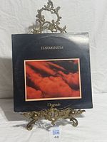 Front cover of the album on display stand