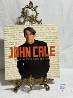Front cover of John Cale Words For The Dying vinyl LP on stand